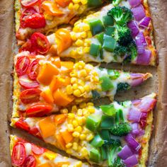 a pizza with many different toppings cut into slices and arranged on top of each other