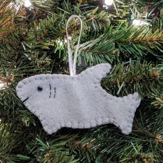 a felt ornament hanging from a christmas tree