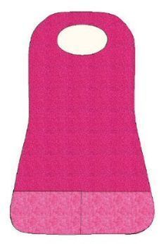 a pink bib that is sitting on top of a white surface with an oval hole in the middle