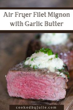 a piece of steak with garlic butter on it and the words air - fryer filet migon with garlic butter