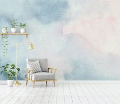 a room with a chair, potted plants and a wall painted in pastel colors