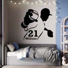 a bedroom with a wall decal that says 21 william and the baseball player is in silhouette