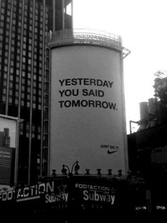 an advertisement on the side of a water tower for nike in new york city's times square