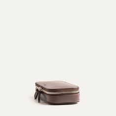 Our Sarah toiletry bag is designed to hold all your essentials for short trips. It slips easily into any bag in our collection. Its compact size means it will fit in the front pocket of our 36-hour backpacks  (Antoine and Gaspard) and our Day backpacks (Giani and Rubens).

It's also the ideal companion for your cables, chargers and batteries for your daily travels.

This toiletry bag will be delivered in a protective pouch. Classic Brown Travel Accessories For On-the-go, Modern Brown Travel Accessories For Business, Brown Cases With Luggage Sleeve For Everyday Use, Brown Rectangular Travel Case, Functional Brown Cases With Luggage Sleeve, Modern Brown Business Pouch, Leather Zipper Pouch Case For Everyday Use, Everyday Leather Zipper Pouch Case, Modern Brown Travel Accessories For Daily Use