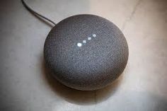 the google home mini is sitting on a table