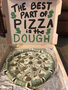 a pizza box with money in it that says the best part of pizza is the dough