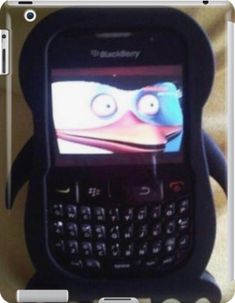 a cell phone with a cartoon character on it's screen and an angry bird face