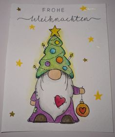 a christmas card with an image of a gnome holding a tree