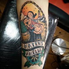 a man with a tattoo on his arm that reads matus amih and has an image of a couple hugging each other