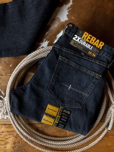 Introducing our new Ariat men's denim line! Rebar edition, built to last. Dark wash denim with subtle hand sanding. Stackable straight leg. Lower rise. Reinforced for twice the durability. Integrated knife pocket. Extra deep front pockets. Heavy duty zipper and hardware. Toughmax™ DuraStretch denim. Slimmer through the seat and thigh. 67% cotton, 32% polyester, 1% spandex. Jeans Washing Effect, Back Pocket Designs Jeans Mens, Men Jeans Pocket Design, Denim Pocket Details, Jean Pocket Detail, Mens Jeans Pockets, Diwali Holiday, Jean Pocket Designs, Mens Designer Jeans