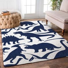 a rug with dinosaurs on it in a living room