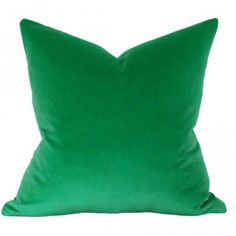 a green pillow on a white background