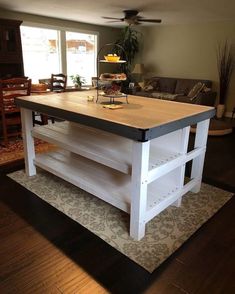 a kitchen island made out of an old table