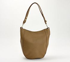 Perfect for everyday carrying, this convertible bag features a spacious interior, luxe pebbled leather, and an adjustable strap that allows it to be worn as a shoulder bag or across the body. From Vince Camuto. Convertible Bags, The Body, Vince Camuto, Pebbled Leather, Convertible, Adjustable Straps, Shoulder Bag, Leather