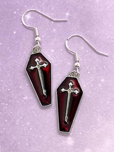 Elegant deep red earrings for vampires and witches because every season is spooky season 🖤 ✨Charms are a beautiful deep burgundy-red and coffin shaped with lead-free and nickel-free zinc alloy with silver-toned backs ✨Earring hooks are hypoallergenic silver-plated and come with clear silicone earring backs ✨Clip-on option is available upon request! Please DM me before purchasing for more information.  ✨Note that colors may appear different in person than they do in the photos. Feel free to let me know you'd like more details or photos! Red Punk Earrings For Gifts, Red Gothic Jewelry For Halloween, Gothic Red Jewelry For Halloween, Red Nickel-free Jewelry For Halloween, Nickel-free Red Halloween Jewelry, Gothic Nickel-free Halloween Earrings, Gothic Nickel-free Earrings For Halloween, Gothic Nickel Free Earrings For Halloween, Vampire Style Dangle Earrings As Gift