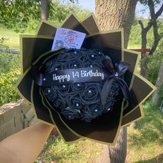 a birthday cake in the shape of a rosette bouquet with happy 14th birthday written on it