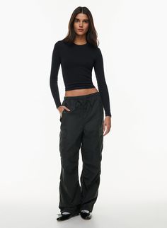 Utility Nylon Parachute Pants With Drawstring, Urban Nylon Parachute Pants With Cargo Pockets, Sporty Parachute Pants With Cargo Pockets For Fall, Utility Parachute Pants With Functional Drawstring, Fall Nylon Cargo Bottoms, Fall Nylon Bottoms With Cargo Pockets, Sporty Nylon Parachute Cargo Pants, Sporty Nylon Parachute Pants In Cargo Style, Urban Nylon Cargo Parachute Pants