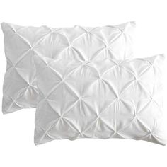 two white pillows sitting next to each other