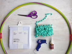 the supplies needed to make this craft include scissors, yarn, glue, and beads