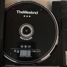 a disc that is sitting on top of a black box with the words the weeknd printed on it