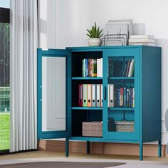 a blue bookcase with many books in it