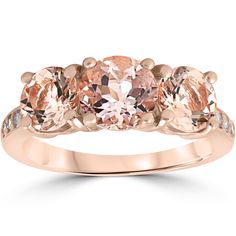 Womens ring features a 7mm morganite center and two 6mm sides.  The ring is flanked with eight round cut diamonds.  All diamonds are set in solid 14k rose gold. Rose Gold Morganite, 3 Stone Engagement Rings, Morganite Diamond, Womens Ring, Cz Rings Engagement, 3 Stone Rings, Diamond Engagement Rings Vintage, Rose Gold Diamond Ring, Princess Cut Engagement Rings