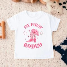 My First Rodeo Birthday Shirt, Rodeo Birthday, Birthday Girl Shirt, Cowgirl Birthday, First Birthday Shirt, Toddler Birthday Shirt - Etsy Cute Top With Name Print For First Birthday, Cute Tops With Name Print For First Birthday, First Birthday Name Print Top, Cute Shirt With Graphic Print For First Birthday, Cute Graphic Print Shirt For First Birthday, Pink Top With Funny Print For First Birthday, Pink Crew Neck Shirt For First Birthday, Pink T-shirt With Funny Print For First Birthday, Pink Shirt With Funny Print For Birthday