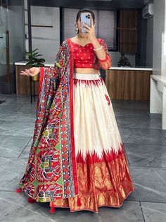 Elevate your ethnic wardrobe with our stunning "adorable off-white & red patola printed silk festival wear lehenga choli." Crafted from high-quality dola silk material in off-white and red colors, this traditional ensemble is adorned with intricate patola and paithni printed work, along with shimmering foil work (crush work) that adds a touch of glamour to the outfit.
This lehenga choli set include a lehenga stitched up to 42 inches with a 3.8-meter flair, a 41-inch lehenga length, and an un Work Crush, Lehenga Stitched, Red Lehenga Choli, Lehenga Crop Top, Lehenga Choli Wedding, Navratri Chaniya Choli, Party Wear Lehenga Choli, Bollywood Lehenga, Half Saree Designs