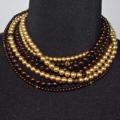 Brown and gold multi strand glass two toned pearls necklace. This is a six strands gray glass pearls that inter twined. Beautiful stacked glass pearls beaded necklace with crystal highlights. A beautiful and chic style for the fall and everyday wear. {"@context":"https://schema.org/","@type":"Product","name":"Multi Strand Brown/ Gold Two Toned Glass Pearls Necklace","image":"https://cdn.shopify.com/s/files/1/1069/4906/products/multi-strand-brown-gold-two-toned-glass-pearls-necklace-jewelry-stran Brown Pearl Necklace, Pearl Jewelry Necklace, Pearls Necklace, Grey Glass, Multi Strand, Necklace Jewelry, Brown Gold, Pearl Beads, The Fall