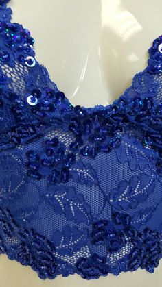 Hand decorated sleeveless lace crop top in Royal Blue color with floral pattern beading with matching sequins and beads. 1. Perfect for any occasion. 2. Available in 4 sizes XS, S, M, and L. 3. Has three rows of hooks-eye closure at the back. 4. Made from stretch lace which helps you adjust to your body size. 5. Individually hand beaded. 6. Light in weight and comfortable. 7. Has cotton lining in the inner bust area to block transparency. 8. Free USPS First Class shipping within the USA. Shippin Crop Top Sleeveless, Corset Fashion, Short Shirt, Tube Tops, Royal Blue Color, Cropped Tube Top, Long Crop Top, Lace Crop Tops, Short Shirts