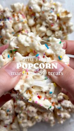 someone is holding some popcorn with sprinkles on it and the words, they've popped marshmallow treats