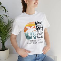 Friends Beach Shirt with Retro Vibes is a perfect summer shirt for your girlfriend trip to the beach! Be ready for your summer vacation with this soft and fun beach tee! Available in White, Peach and Grey. To personalize: Write city and year in the personalization box on this page. You can change the customization to say whatever you like - for a bridesmaid weekend it could say "Heidi's Hens, or Taylor's Crew, Bride Squad etc. If the box is left blank, there will be no city/year added to the shi White Tropical T-shirt For Beach Season, Trendy White Print T-shirt For Beach, Trendy White Print T-shirt For Vacation, White Beachy T-shirt For Beach Party, White T-shirt For Beach Vacation, Pre-shrunk Summer T-shirt For The Beach, Tropical T-shirt For Beach Season Vacation, Summer T-shirt For Beach Vacation, Tropical T-shirt For Beach Vacation