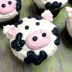 several cupcakes decorated with black and white frosting