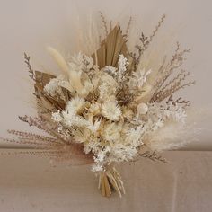 a bouquet of dried flowers on a table