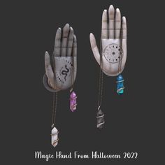 two gloves with chains attached to them and charms hanging from the palm of one hand