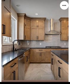 an image of a kitchen setting with wood cabinets and granite counter tops in the middle