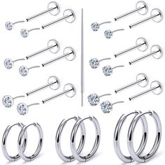 a set of six pairs of surgical piercings