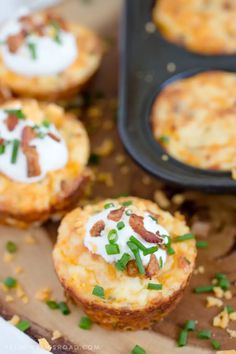 mini quiches with bacon and sour cream on top are ready to be eaten