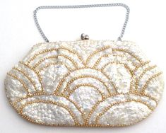 Vintage Handbags - This is an ivory purse fully covered with cream faux pearl beads and iridescent sequins. It has a silver tone kiss closure, chain handle and original mirror in the inside pocket. The purse measures 9" by 5", chain handle has a 5" hang. Silk lining has a small spot and tag that reads La Regale Made in Japan of American Sequins. If you are an international buyer: All of our jewelry is set up with a standard shipping charge, but the purses may be more. Please contact us for a shi Elegant White Sequined Bags, Embellished Cream Evening Bag For Party, White Sequined Bags For Wedding, White Sequin Bag For Wedding, White Sequin Party Bag, White Sequined Wedding Bag, Glamorous White Beaded Evening Bag, Vintage White Clutch For Party, Cream Evening Bag With Pearl Embroidery For Party