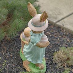 a statue of a rabbit with a hat on