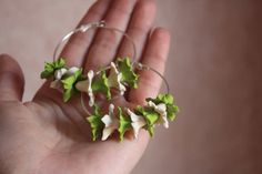 Discover Exquisite Handcrafted Floral Jewelry Delicate hoop earrings for a stylish look. Composition consists of stephanotises. Warning: no exposure to water.  Every flower is handcrafted from self hardening, lightweight,polymer clay, decoclay. 🌻 Jewelry for Every Occasion: Whether it's a special celebration, wedding, or simply adding a touch of nature to your everyday look, our floral earrings and rings are the perfect choice. They make memorable gifts for loved ones too. Green Flower Hoop Earrings For Gift, Unique Green Hoop Earrings, Green Flower-shaped Nature-inspired Earrings, Nature-inspired Green Flower Earrings, Handmade Green Flower Hoop Earrings, Green Flower Earrings For Gifts, Green Flower Earrings, Jewelry Delicate, Floral Jewelry