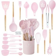 pink kitchen utensils and spoons in a cup