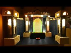 an elaborately decorated room with mirrors and lights on the walls is seen in this image