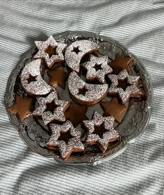 there are many cookies on the plate with stars