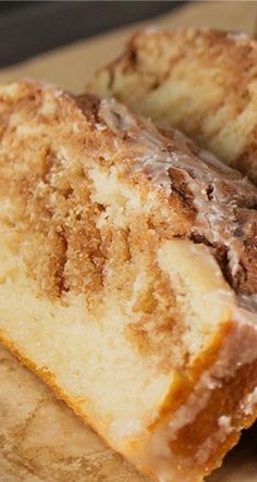 several pieces of cake sitting on top of a piece of parchment paper with chocolate frosting