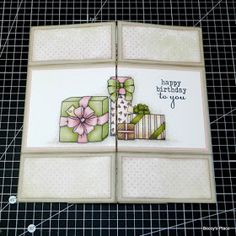 an open card with a gift box on it and the words happy birthday to you