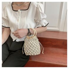 The Emes Shop bag is detailed with a minimalist crochet design. Features a ring handle. drawstring pouch inside. and bracelet bag style.MATERIAL:100%Vegan Leather / Strands 100% Cotton BlendMEASUREMENTS:H" X W"X D" 16cm X 15cm X 13cm 6.3in X 6in X 5.1in Minimalist Crochet, Canvas Backpack Men, Leather Bags Women, Bracelet Bag, Shop Bag, Handbags Luxury, Ring Handle, Crochet Bracelet, Designer Crossbody Bags