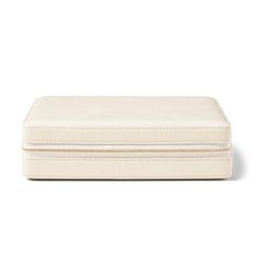 an empty white box with zippers on the lid and bottom, sitting against a white background