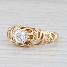 a gold ring with a diamond in the center