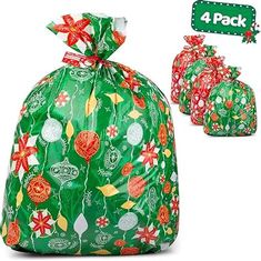 a green bag filled with lots of christmas decorations